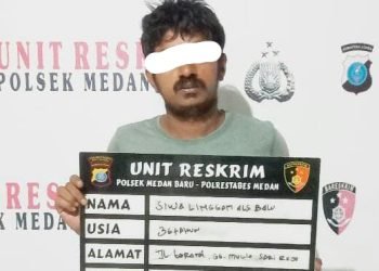 Pelaku perampokan, SL saat diamankan di Polsek Medan Baru.