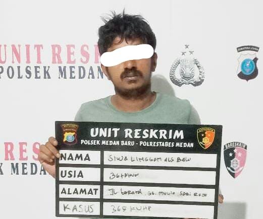 Pelaku perampokan, SL saat diamankan di Polsek Medan Baru.