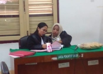 JPU membacakan dakwaan terhadap terdakwa Jumidah yang diikuti terdakwa secara daring. 