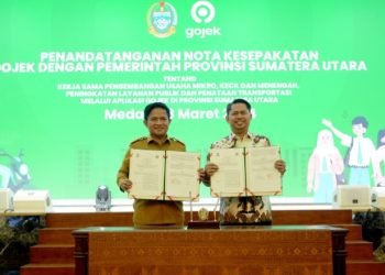 Pj Gubernur Sumatera Utara (Sumut) Hassanudin  menandatangani nota kesepakatan kerjasama dengan PT Goto Gojek Tokopedia di Aula Raja Inal Siregar, Kantor Gubernur Sumut, Jalan Diponegoro Nomor 30 Medan, Senin (18/3). (Diskominfo Sumut)
