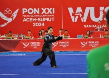 Atlet Wushu andalan Kontingen Sumatera Utara Nicolas Sedang beraksi di Gedung Serbaguna Pancing, Deliserdang, Sumatra Utara, Kamis (12/9/2024). Nicolas sukses    mengharumkan nama Sumatera Utara dengan membawa emas di nomor Wushu Taolu Taijiquan Putra. (PB PON XXI Sumut/Yuni Naibaho)