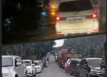 Kemacetan terjadi di Jalinsum Labuhanbatu-Labura akibat hujan dari luapan Sungai Bandar Durian, Kecamatan Aek Natas, Labuhanbatu Utara. 