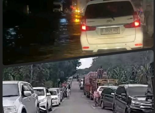 Kemacetan terjadi di Jalinsum Labuhanbatu-Labura akibat hujan dari luapan Sungai Bandar Durian, Kecamatan Aek Natas, Labuhanbatu Utara. 