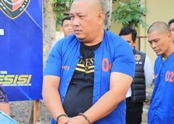 Tampang pelaku Hudian saat ditangkap petugas kepolisian.