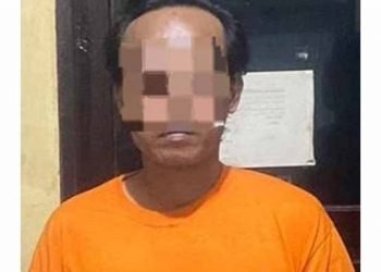 Pelaku saat diamankan di unit PPA (Perlindungan Perempuan dan Anak) Polresta Deli Serdang. 